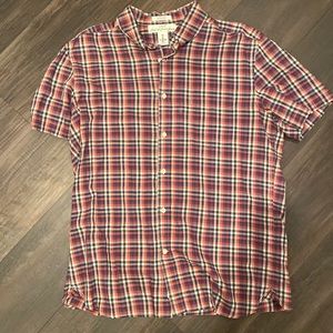 Logg label of graded goods size large button up shirt.